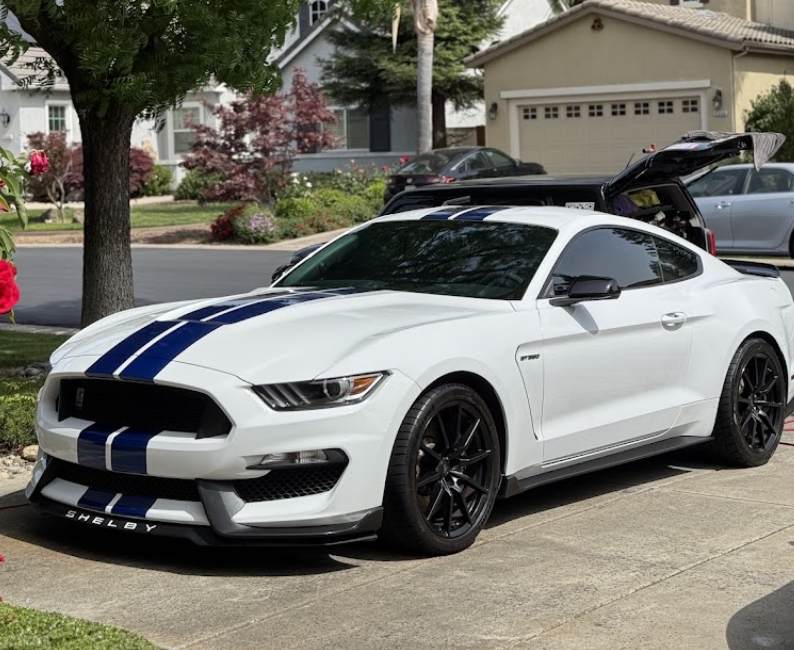 Detailed white Shelby Mustang at a customer’s home