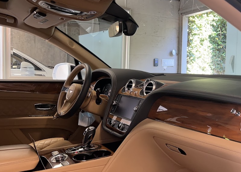 Clean tan Bentley interior after professional detailing